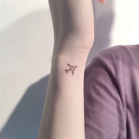 tiny airplane tattoo|fine line airplane tattoo.